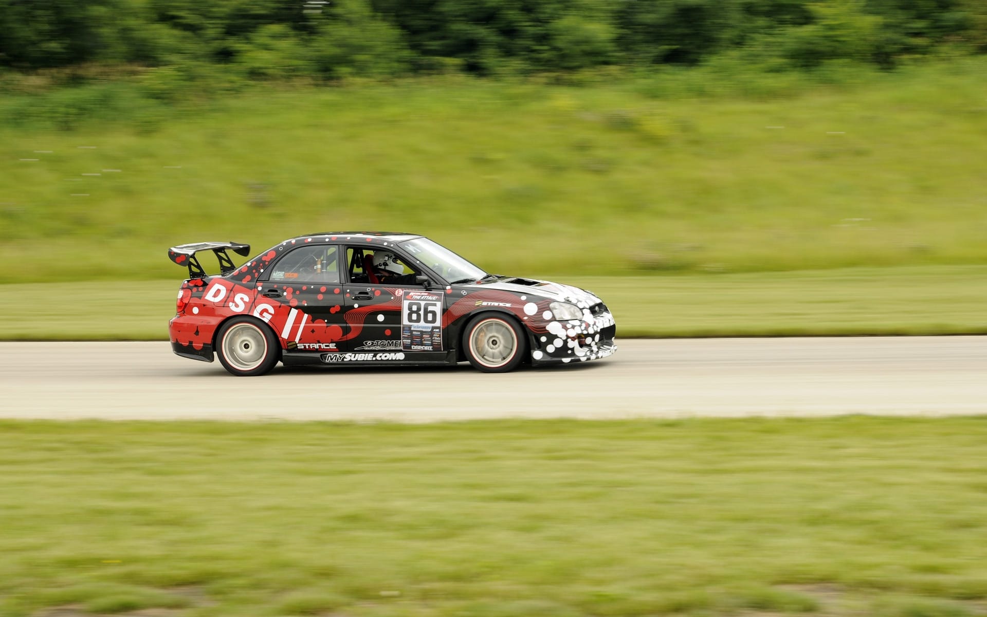 The "RASpec Impreza 1.0" racing at Summit Point in the Redline Time Attack series, 2010.